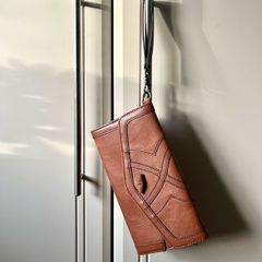 Johnny Loves Rosie clutch bag