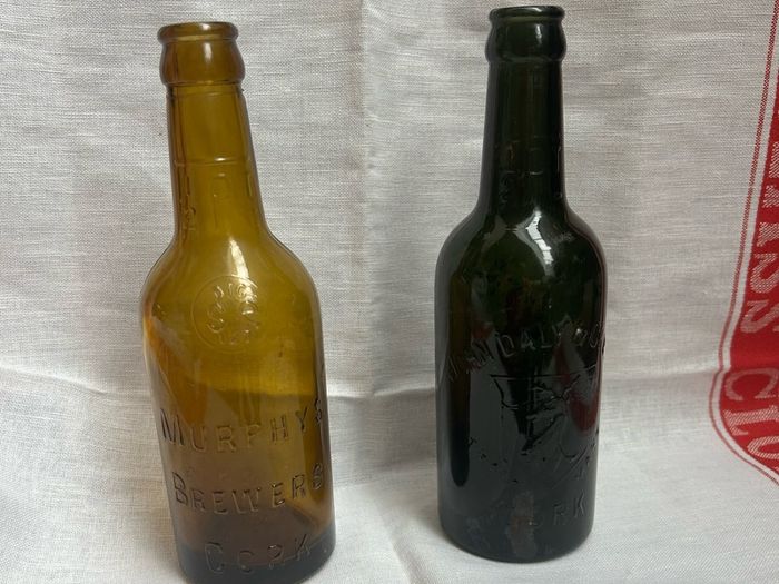 Antique Cork Advertising Bottles x2