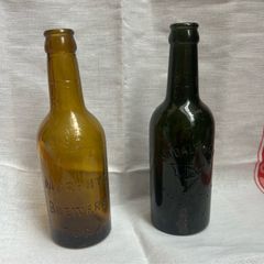 Antique Cork Advertising Bottles x2