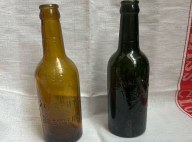 Antique Cork Advertising Bottles x2