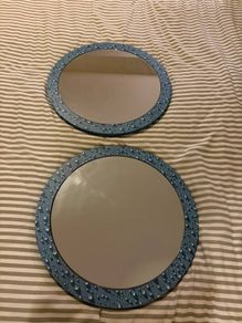 Two round mirrors with water drop pattern frames
