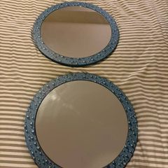 Two round mirrors with water drop pattern frames