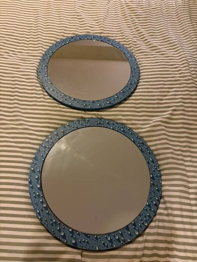 Two round mirrors with water drop pattern frames