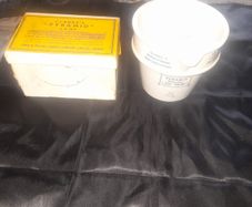 Clarkes Pyramid lamp night light and an Advertisment Box, comprising a white glazed ceramic reservoir marked Prices Patent Candle Company Limited, London