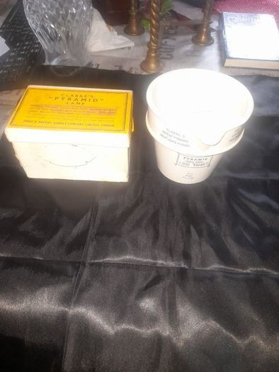 Clarkes Pyramid lamp night light and an Advertisment Box, comprising a white glazed ceramic reservoir marked Prices Patent Candle Company Limited, London