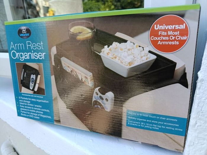 TV arm rest organiser