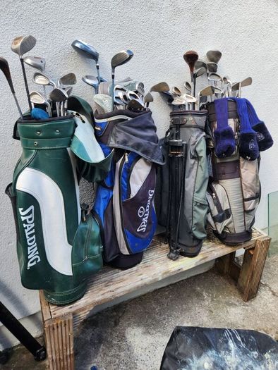 five golf bags and sixty nine clubs . ONE LOT ONLE.