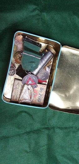 old tin and contents