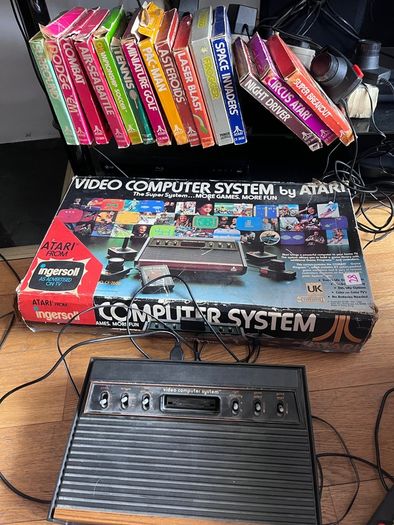 Atari 2600 Space Invaders Woody Atari 2600 with 15 individual games and 14 game Indy 500 driving