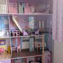 Large wooden dolls house with furniture Image 3