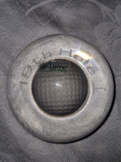 Galway Crystal paperweight with a golf ball