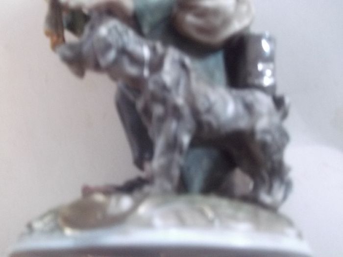 a lovely figurine of the man of the road