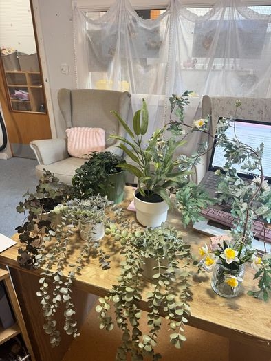 Collection of fake plants and pots