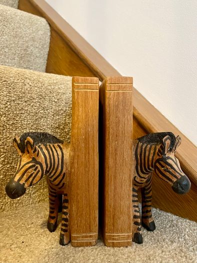 Early c20th hand-carved wooden zebra bookends
