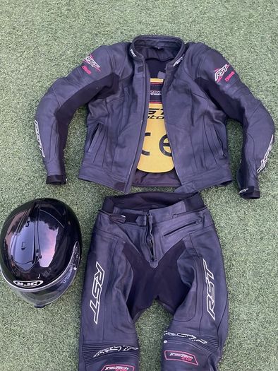 Motor cycle racing leathers with boots, gloves and helmet.