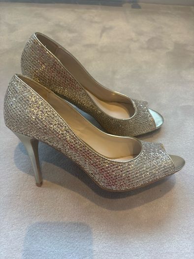 Gold glitter peep-toe heels.