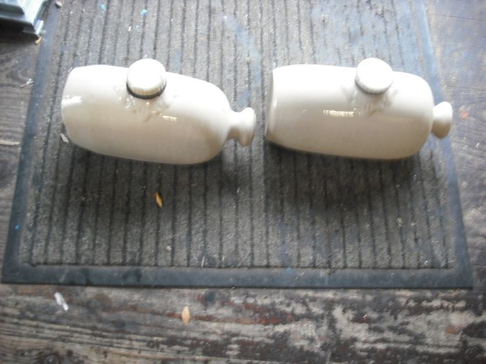 a 2 antique hot water  bottles or foot warmer