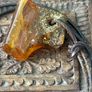 Raw Amber on leather Image 2