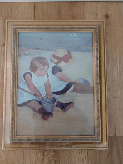 Framed reproduction of Mary Cassatt's "Children Playing on the Beach"