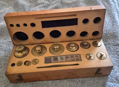 Cased set of brass vintage chemist / apothecary weights.