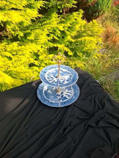 Blue willow style cake stand light chip at the back