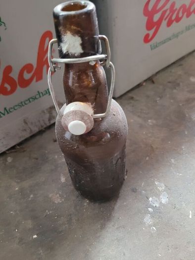 Grolsch beer brown glass bottles with porcelain swing caps.