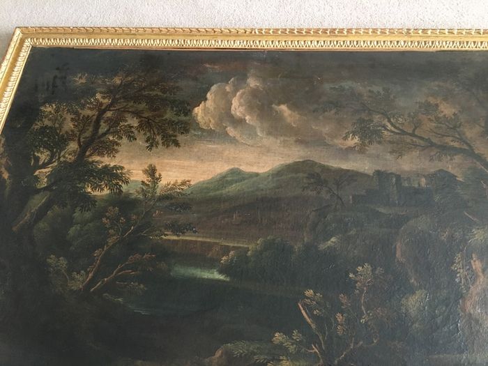 Circle of Francesco Zuccarelli  mountainous landscape by a lake with a fortress
