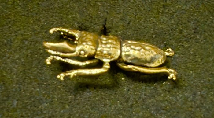 3 brass beetles.