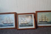 Framed pictures of old ships.
