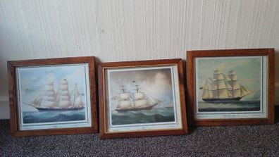 Framed pictures of old ships.