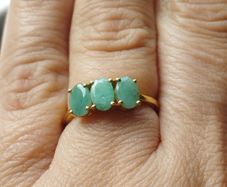 A trilogy ring for women with emeralds and 925 sterling silver in gold plated,TJC..
