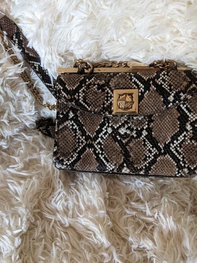 Handbag by Carlos Santana