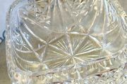 Vintage cut crystal bowl or vase featuring a decorative pinwheel or starburst pattern similar to those produced by manufacturers like Waterford or Edinburgh Crystal.  no stamp