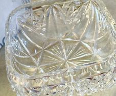 Vintage cut crystal bowl or vase featuring a decorative pinwheel or starburst pattern similar to those produced by manufacturers like Waterford or Edinburgh Crystal.  no stamp