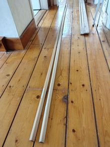 Two 2.4m Wooden moulding at right angles.  20mm x 20mm x 2.4m