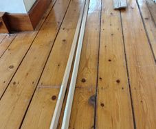 Two 2.4m Wooden moulding at right angles.  20mm x 20mm x 2.4m