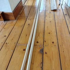 Two 2.4m Wooden moulding at right angles.  20mm x 20mm x 2.4m