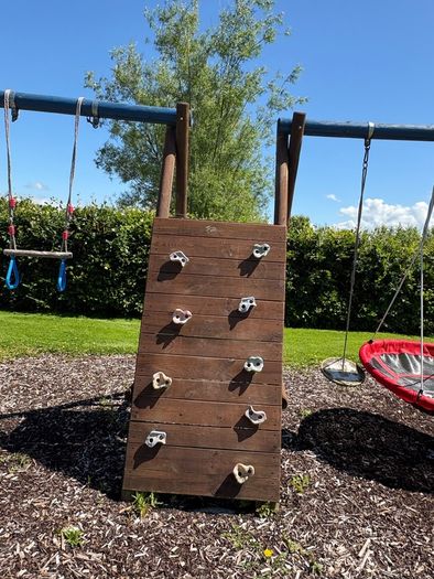 Swing slide climbing wall