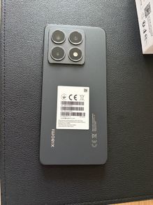 Xiaomi 14T phone with earbuds