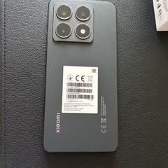 Xiaomi 14T phone with earbuds
