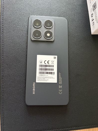 Xiaomi 14T phone with earbuds