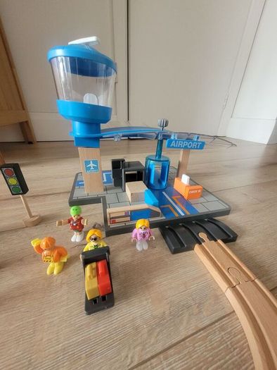 wooden train play set with two electric locomotives and lots of parts