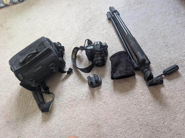Nikon D7000 DSLR + Nikon 50mm f/1.8G + Tamron 18-200mm + Tripod + Camera Bag