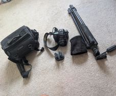 Nikon D7000 DSLR + Nikon 50mm f/1.8G + Tamron 18-200mm + Tripod + Camera Bag