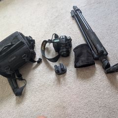 Nikon D7000 DSLR + Nikon 50mm f/1.8G + Tamron 18-200mm + Tripod + Camera Bag