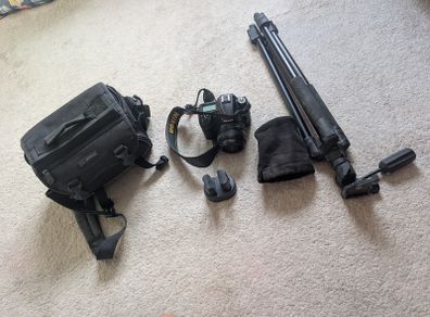 Nikon D7000 DSLR + Nikon 50mm f/1.8G + Tamron 18-200mm + Tripod + Camera Bag