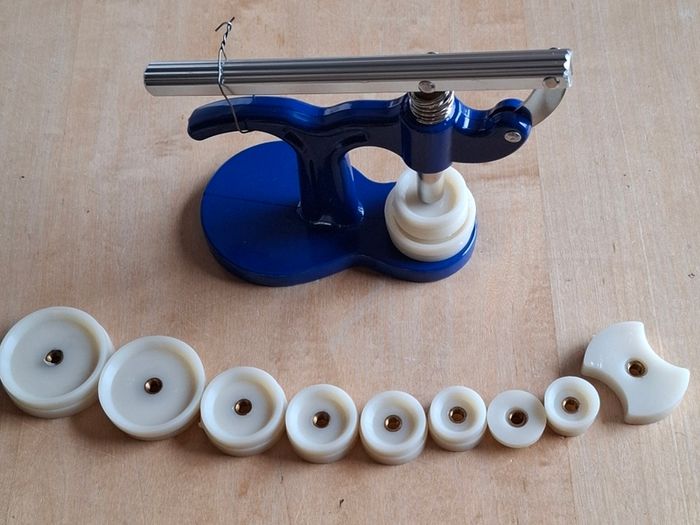 Watch back press