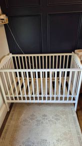 Nested wooden cot with mattress