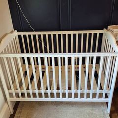 Nested wooden cot with mattress