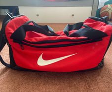 Red Nike sports duffel bag